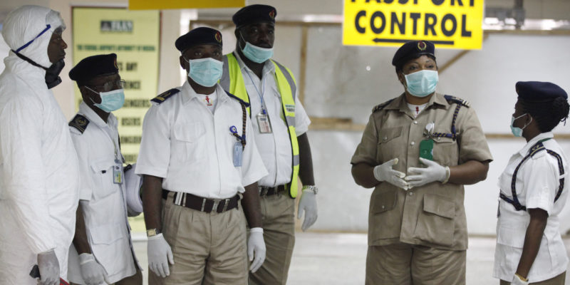 Nigeria health officials wait to screen passengers at the arrival hall of Murtala Muhammed International Airport in Lagos, Nigeria, Monday, Aug. 4, 2014. Nigerian authorities on Monday confirmed a second case of Ebola in Africa's most populous country, an alarming setback as officials across the region battle to stop the spread of a disease that has killed more than 700 people. (AP Photo/Sunday Alamba)